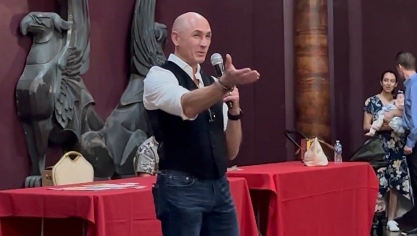 Glenn Hemanes speaking to a group